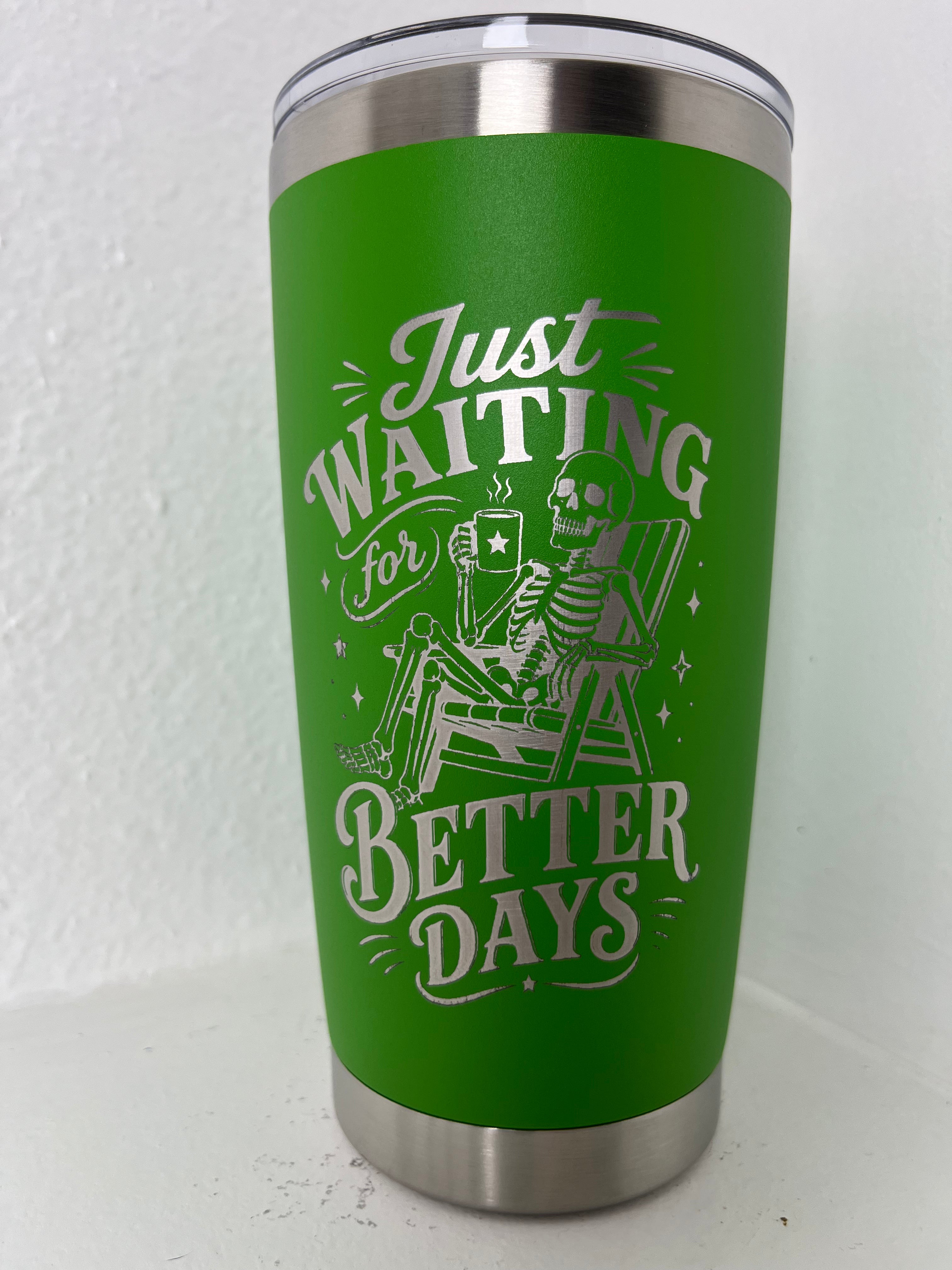 Green tumbler with skeleton design and text 